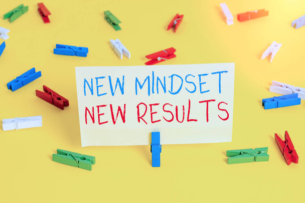 Word writing text New Mindset New Results. Business concept for obstacles are opportunities to reach achievement Colored clothespin papers empty reminder yellow floor background office. - Foto, Imagen