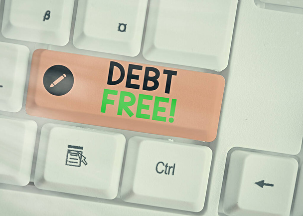 Writing note showing Debt Free. Business photo showcasing free from owning any money to any individual or a company. - Photo, Image