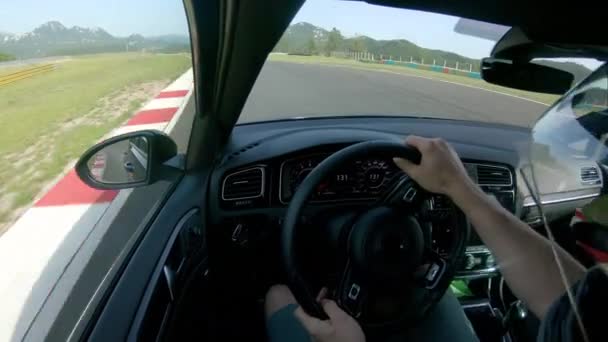 CLOSE UP: Extreme racer preparing for a race by driving around the raceway. - Footage, Video