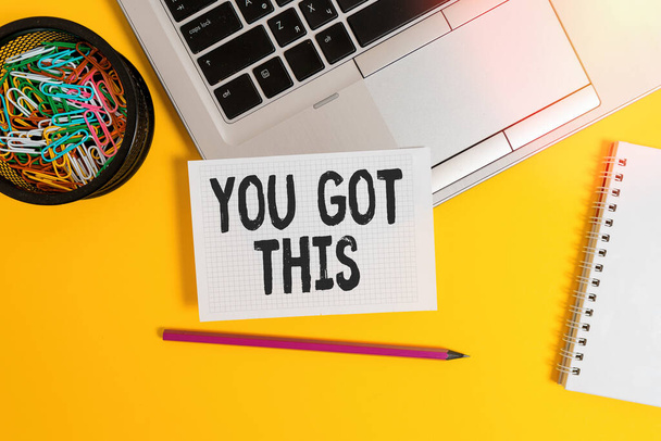 Writing note showing You Got This. Business photo showcasing to encourage someone to succeed in dealing with something Laptop pencil squared paper sheet container spiral colored background. - Foto, afbeelding