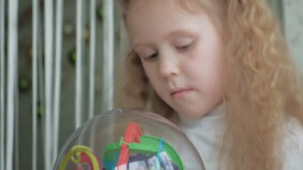 Little girl play with three-dimensional toy puzzle - Footage, Video