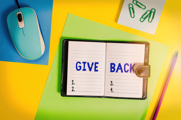 Writing note showing Give Back. Business photo showcasing the act of giving someone something that they owned or had before Locked diary striped sheets marker notepad mouse colored background. - Photo, Image