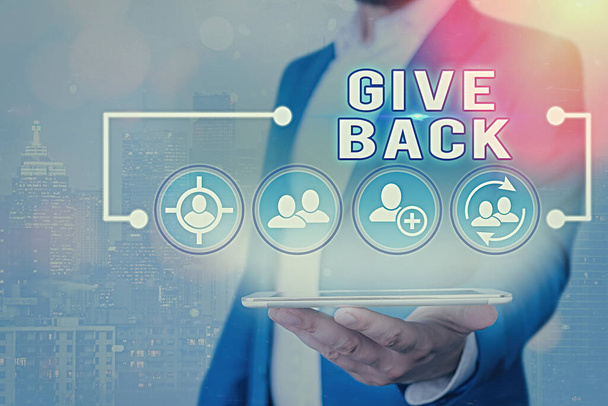 Signo de texto que muestra Give Back. Foto conceptual el acto de dar a alguien algo que poseía o tenía antes
. - Foto, imagen