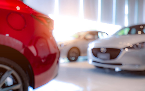 Blurred of white and red luxury car parked in modern showroom. Car dealership office. Electric car business concept. Automobile leasing. Automotive industry crisis background concept. Shiny car. - Zdjęcie, obraz