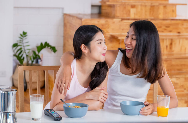 Happy asian lesbian woman couple have breakfast at house in morning with love and tender.LGBTQ lifestyle concept - Фото, изображение
