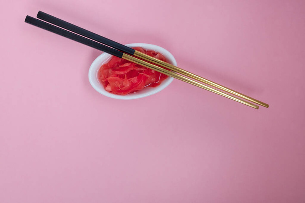Marinated ginger and chopsticks - Фото, изображение