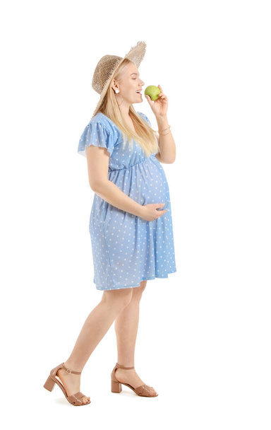 Beautiful pregnant woman with apple on white background - Фото, зображення