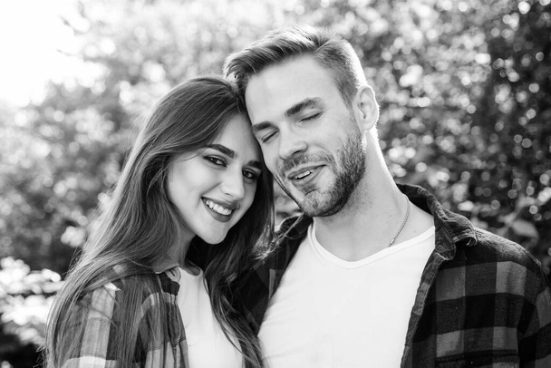 Enjoying each other. Man hipster and pretty woman in love. Summer vacation. Fall in love. Pure feelings. Romantic date concept. Cuddling with darling. Beautiful people. Happy together. Couple in love - 写真・画像