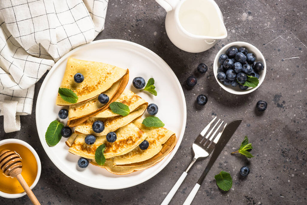 Crepes with blueberries and honey. - Fotografie, Obrázek