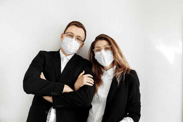 Young business people wearing face masks in studio  - Foto, immagini