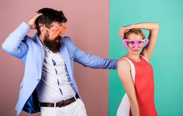 Dancing together. Couple having fun. Office party. Celebrating success. Good mood. Relax and have fun. Corporate culture. Celebrating holiday. Bearded man pretty woman party goggles celebrating - Foto, Bild