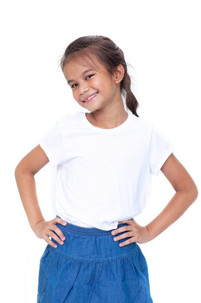 young Asian girl with arms akimbo isolated on white background - Photo, Image