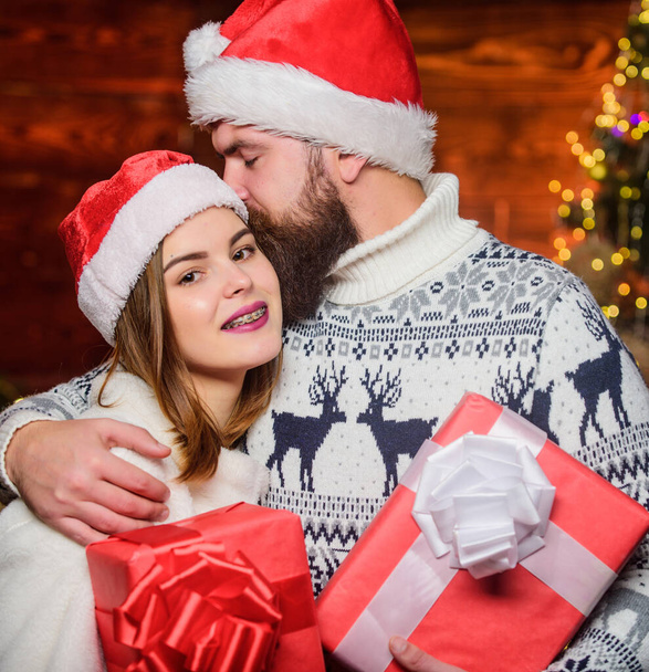 love portrait. family holiday weekend. lovers at decorated tree. happy santa couple in love. merry christmas. love is in air. celebrate new year together. xmas presents. winter season shopping sales - Foto, imagen
