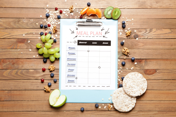 Healthy products and meal plan on wooden background - Photo, Image