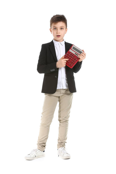 Surprised little boy with calculator on white background - Foto, Imagem