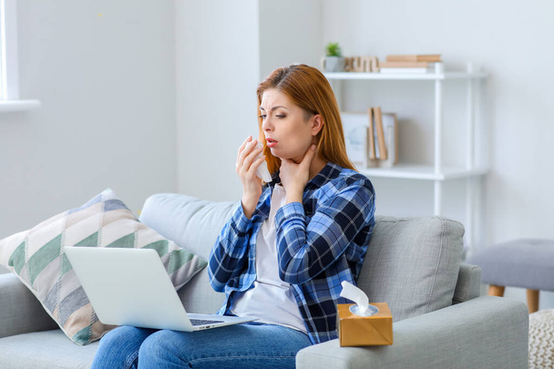 Sick woman with laptop at home - Photo, Image