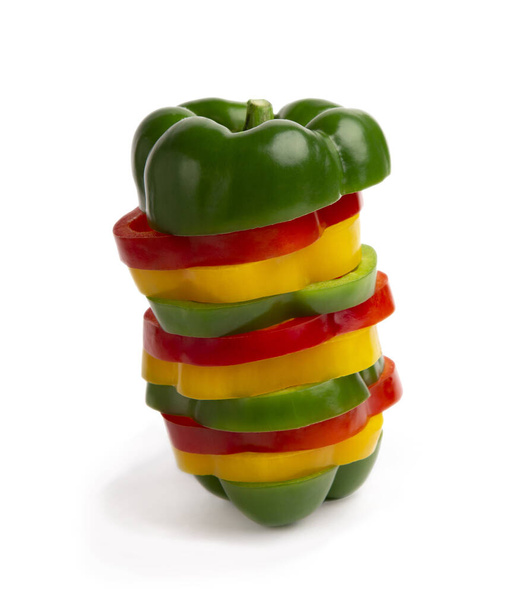 Colorful bell peppers slices on white background - Fotó, kép