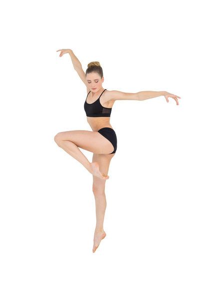 Calm slim model jumping in the air - Valokuva, kuva
