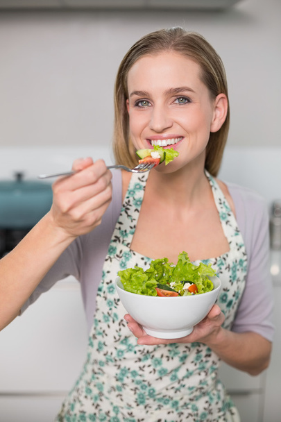 Smiling gorgeous model eating salad - Фото, изображение