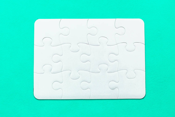 Jigsaw Puzzle with missing piece on mint background Top view - Foto, afbeelding