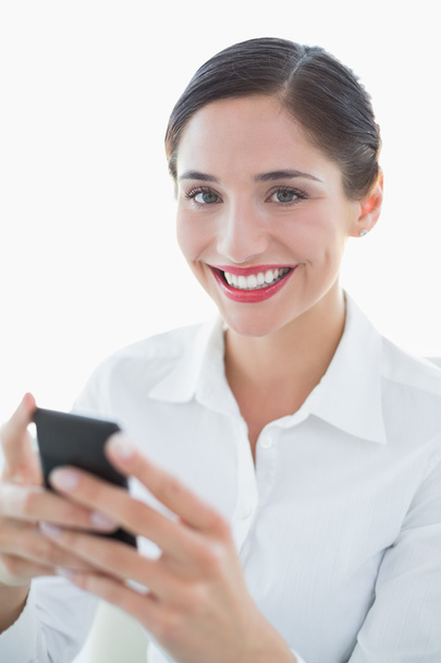 Beautiful young business woman with mobile phone - Foto, afbeelding
