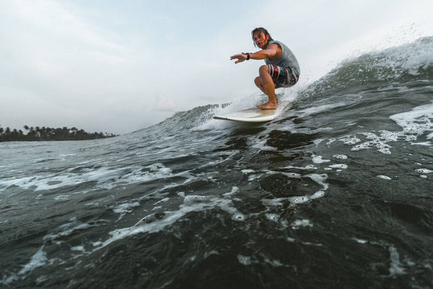 Surfer rides the wave during a day - Fotografie, Obrázek
