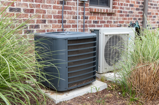 HVAC Air Conditioner Compressor and a Mini-split system together - Photo, Image