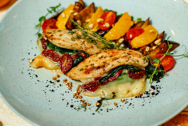 chicken breast with mashed potatoes and grilled vegetables and ingredients served on the table - 写真・画像
