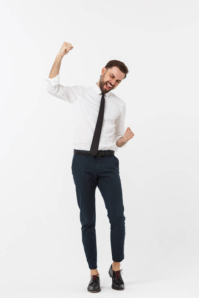 full-length portrait of happy businessman in formal wear with raising hands up. isolated on white background. - Photo, Image