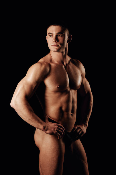 Strong men posing and showing muscles. Great shape before championship. Perfect for sport nutrition promo. Athlete and bodybuilder. Close-ups. Black background.  - Photo, Image