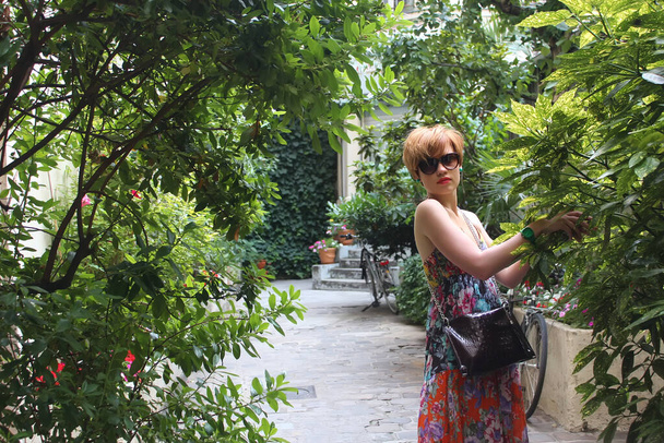 Beautiful young Parisian woman posing in Tuileries Garden - Photo, Image