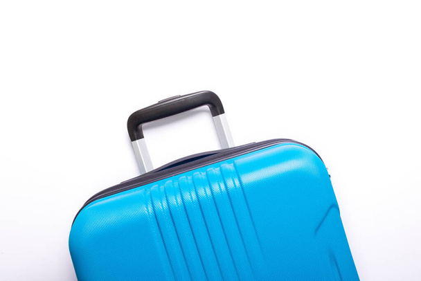 Blue suitcase on white background Summer holidays, vacation, travel concept Minimal Copy space - 写真・画像