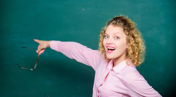 Inspired to work hard. Girl prepare for exams. girl teacher at school lesson. back to school. empty blackboard. Formal informal and nonformal education. happy student with glasses at blackboard - Foto, imagen