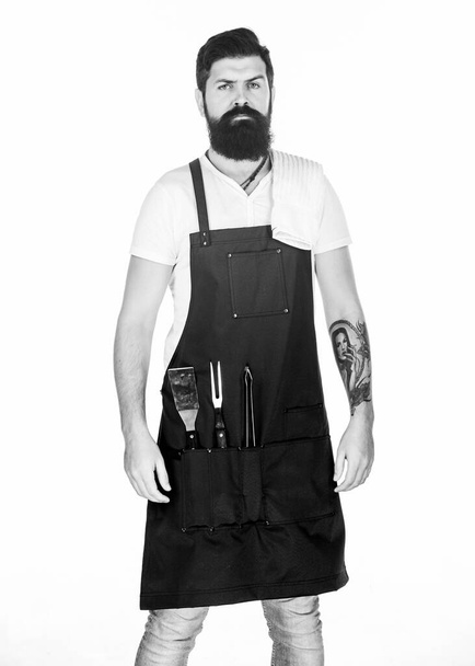 Bearded hipster wear apron for barbecue. Roasting and grilling food. Tips cooking meat. Tools for roasting meat outdoors. Picnic and barbecue. How choose meat for steak. Professional barbecue utensil - Foto, immagini