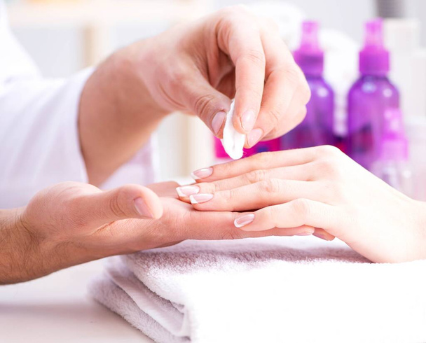 Hands during manicure care session - Photo, Image
