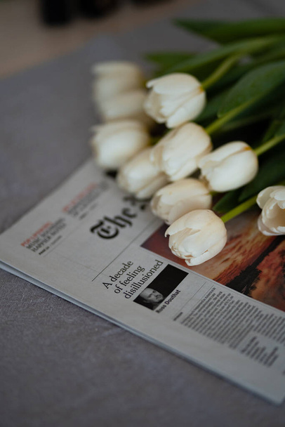 tulips on newspaper, selective focus - Photo, Image