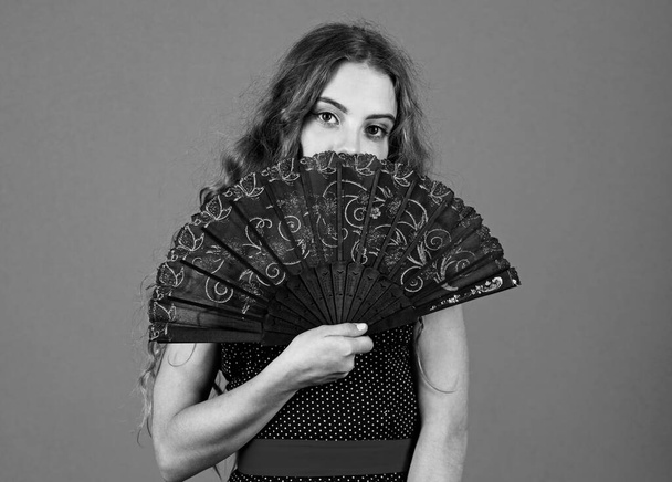 Perfect female. true lady cover her face. vintage portrait. carnival or masquerade. theatre performance concept. spanish dance attribute. summer fan accessory. retro girl use fan. Acting school - Fotó, kép