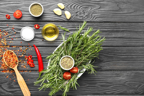 Composition with different spices on wooden background - Photo, Image