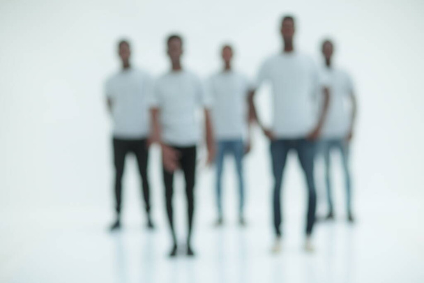 blurry image of a group of young men in white t-shirts - Foto, Imagem