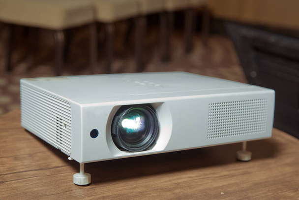 LCD video projector at business conference or lecture in office with copy space . LCD video projector at business conference or lecture in office with copy space. projector on ceiling indoors. - Photo, Image