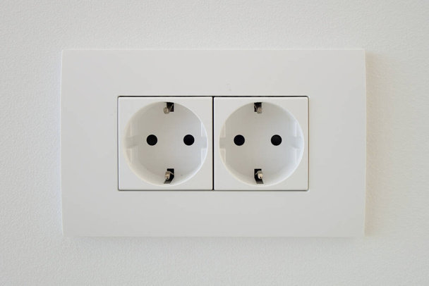Block of white outlets, consisting of two EU standard outlets with grounding - Photo, Image