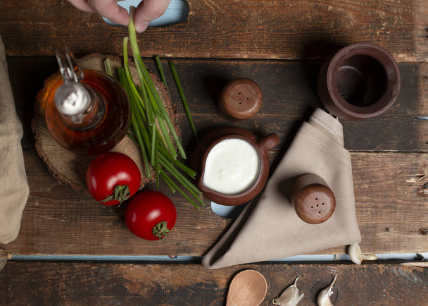 yogurt and tomato with wooden background - Fotó, kép