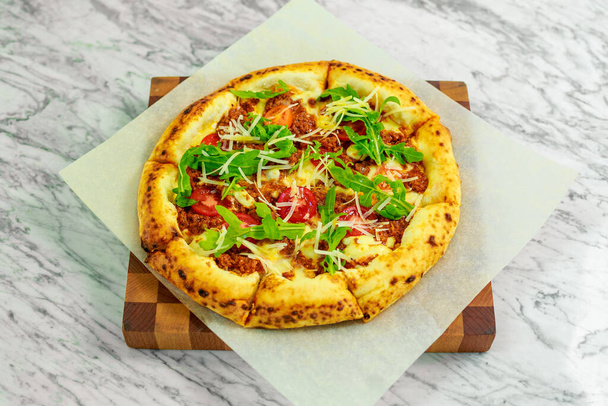 Italian pizza with mozzarella and basil - Fotoğraf, Görsel