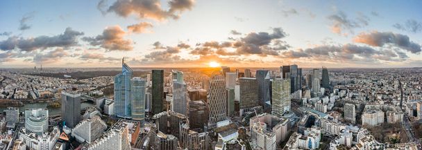 Aerial panoramic drone shot of La Defense skycraper with park diderot in Paris with clouds before sunset - Photo, Image