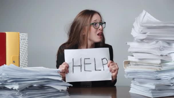 Nervous breakdown at work, screaming office worker with glasses sitting at the table among the piles of unfilled documents and file folders. Overtime working day, accounting process, office career - Footage, Video