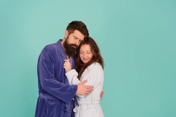 Sleepy people blue background. Couple in love bathrobes. Drowsy and weak in morning. Advice relationships surviving quarantine. Morning routine. Couple sleepy faces domestic clothes. All day pajamas - Foto, imagen