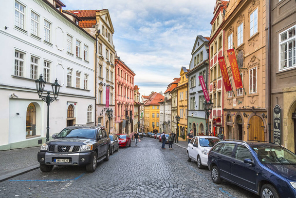Prague, Czech Republic-may 04, 2015; Urban landscape-Nerudova street with beautiful old houses and modern cars parked on both sides of the street - Foto, immagini