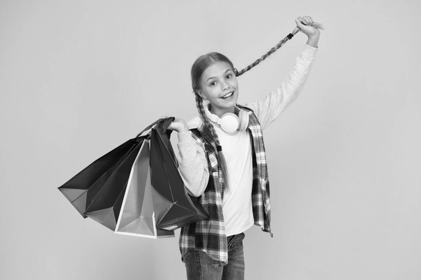 holiday gifts in packages. cyber monday. hurry up its total sale. Kids fashion. Sales and discounts. happy small girl after successful shopping. cute child with heavy bags. Best outfit ever - Photo, Image