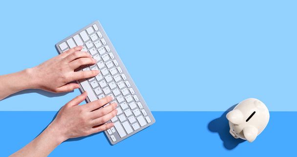 Woman using a computer keyboard - Photo, Image