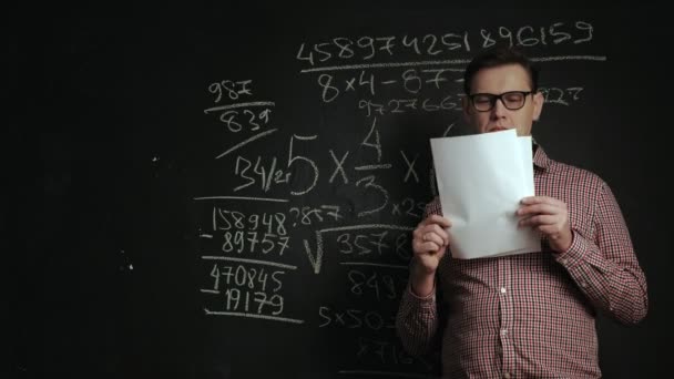 man writes math formula on blackboard - Footage, Video